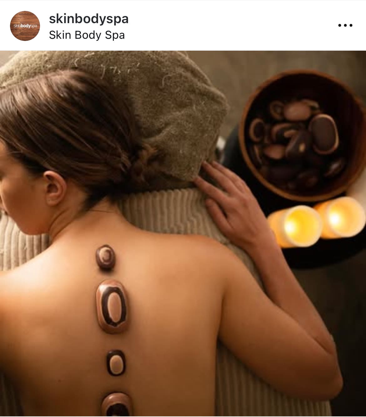 lady receiving hot stone massage